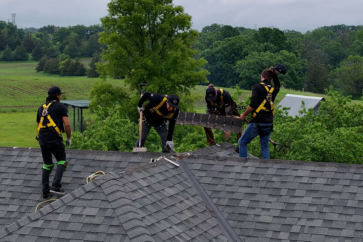 Crown Exteriors crew working on a roof