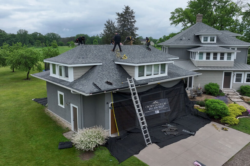 Crown Exteriors crew working on a roof